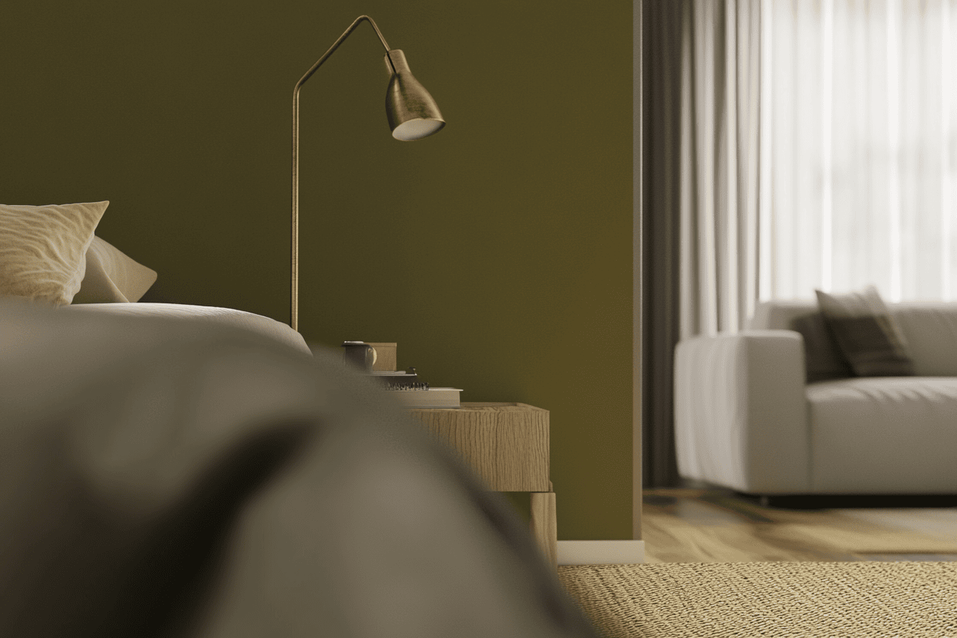 Coin chambre avec mur vert olive et salon blanc lumineux, séparés par la peinture